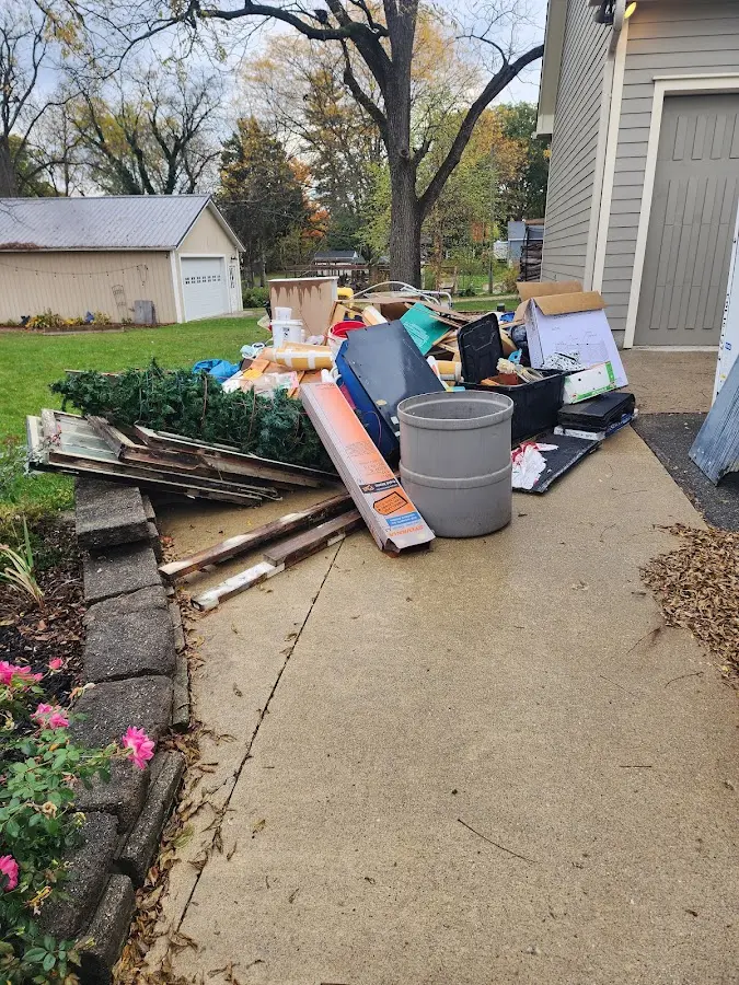 Dumpster being loaded with debris for 3 Yard Dumpster Rental in Ulster